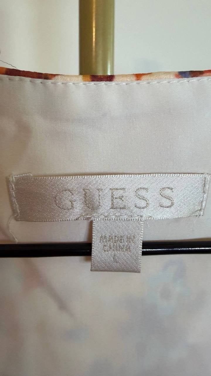 GUESS Women’s Ferra Wrap Top Daisy Peplum SizeL NWT(damaged on the shoulder)mult